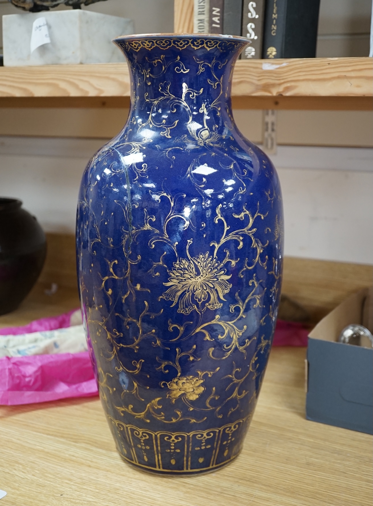 A Chinese gilt decorated blue glazed vase, early 19th century, 48.5cm high. Condition - one side has a large oval break which as been reglued, the gilt decoration is rubbed